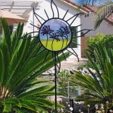 Sun-shaped garden stake with palm painting