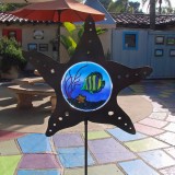 Metal star garden stake with stained-glass fish