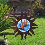 Sun-shaped garden ornament with bird-of-paradise