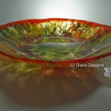 Orange and green fused glass bowl