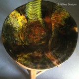 Round resin tabletop with green amber swirls