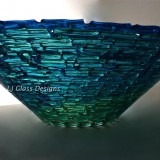 Textured blue-green fused glass bowl
